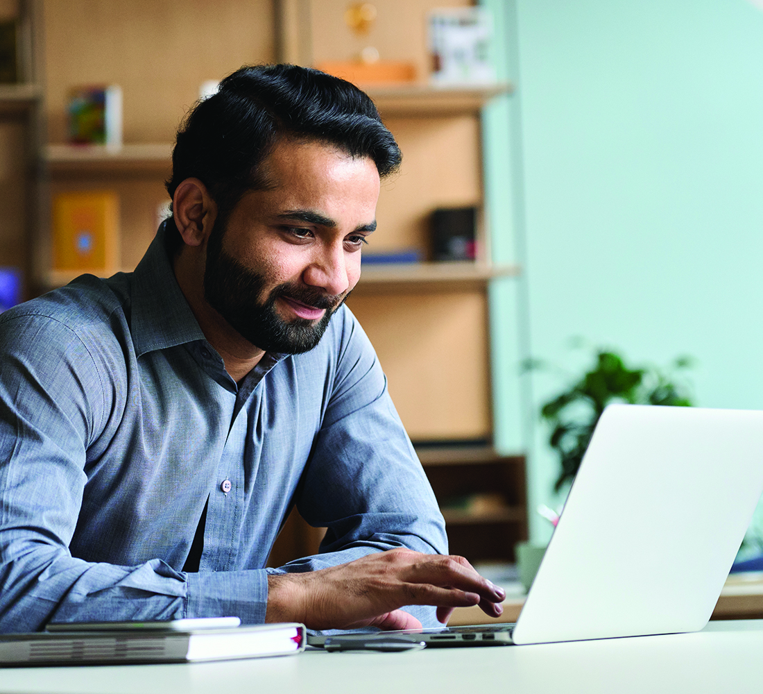 man banking online with his laptop