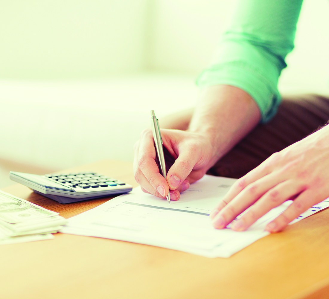 woman doing paperwork for checking account