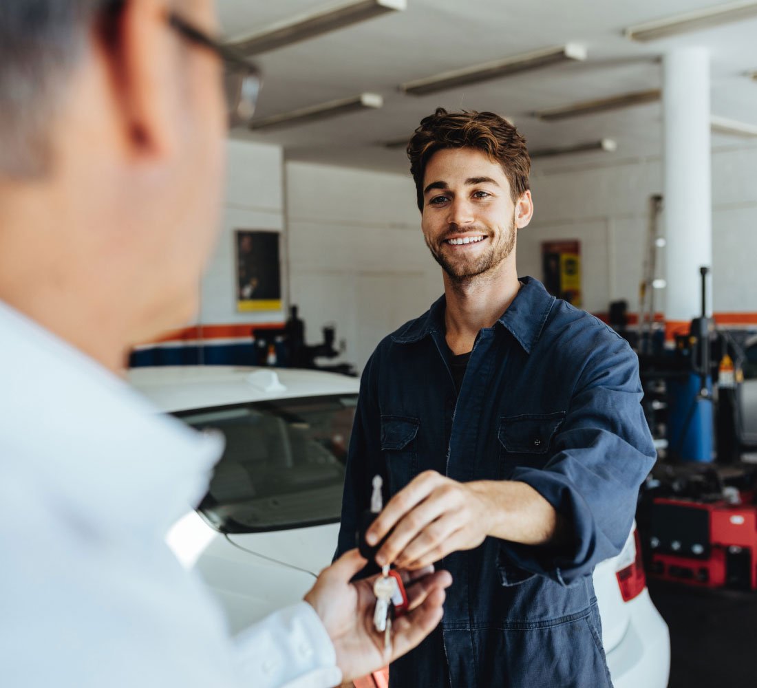 mechanic giving car keys 