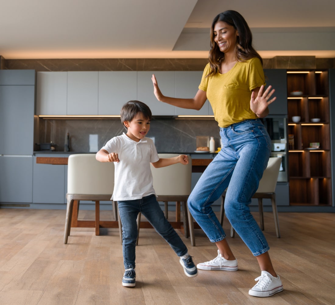 woman and kid dancing