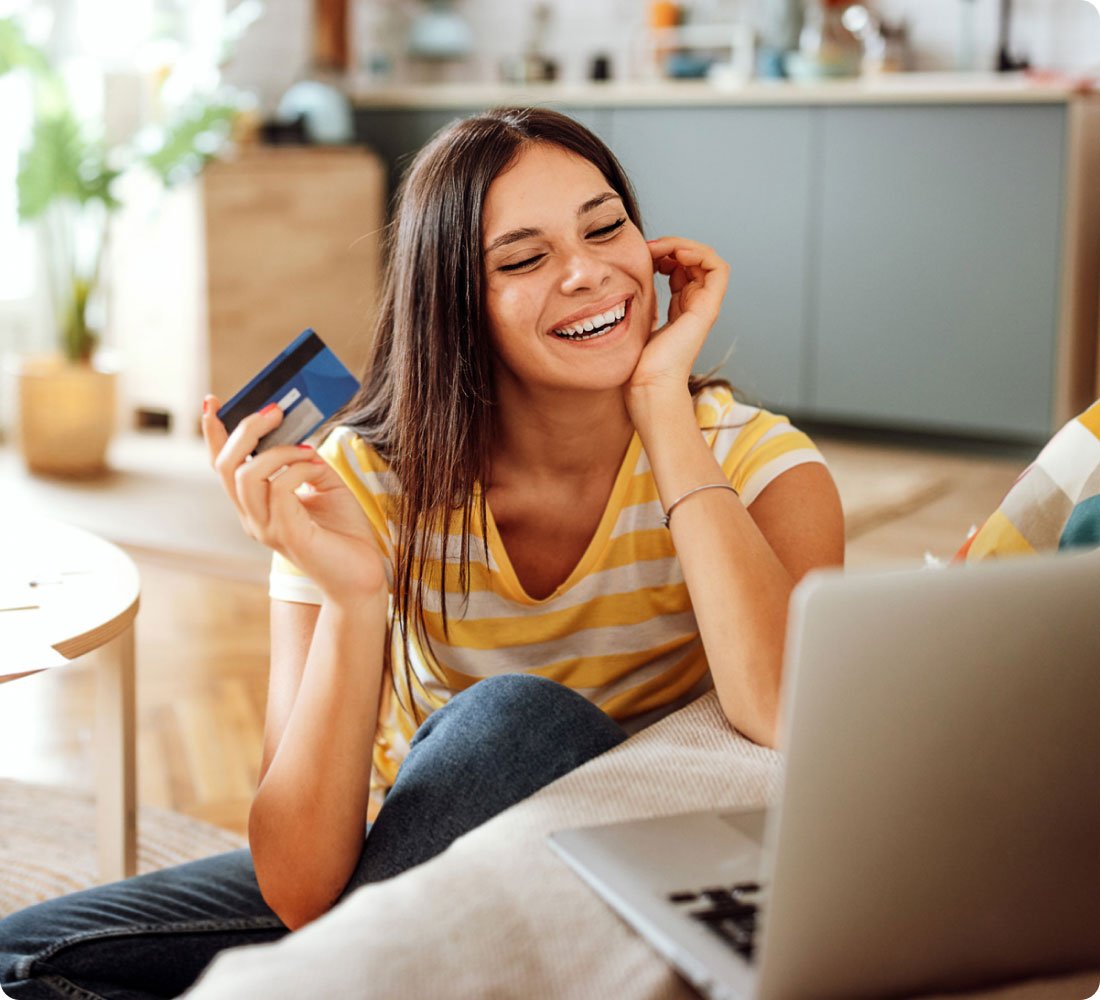 woman smiling looking at laptop