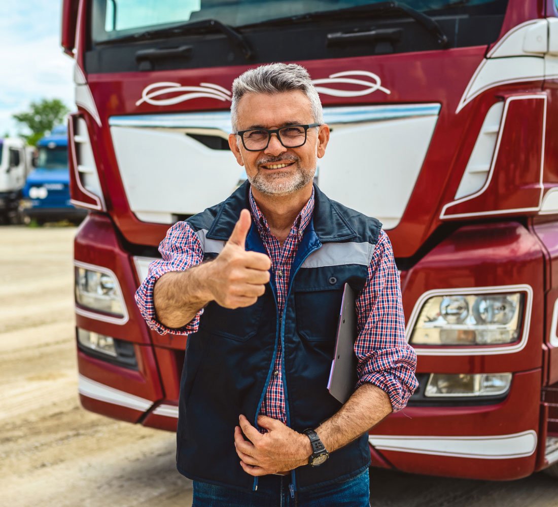 man in front of truck smiling