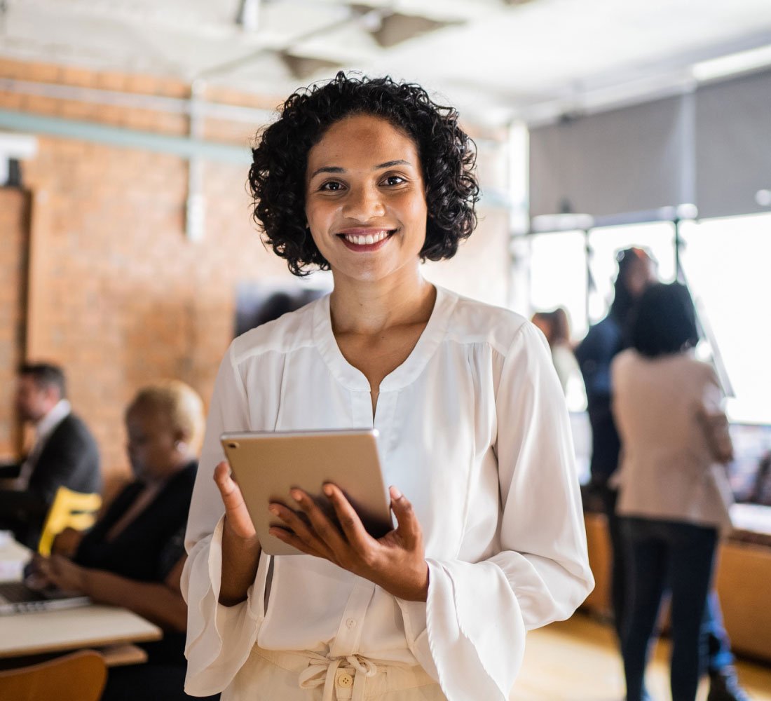 woman smiling with tablet