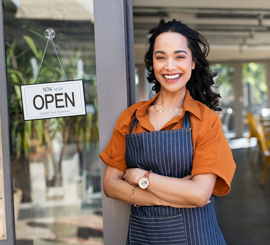 woman standing in front of business