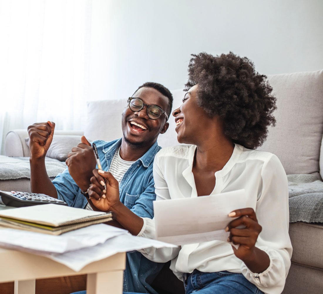 husband and wife smiling and laughing