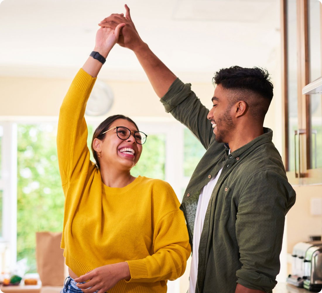 couple dancing in kitchen