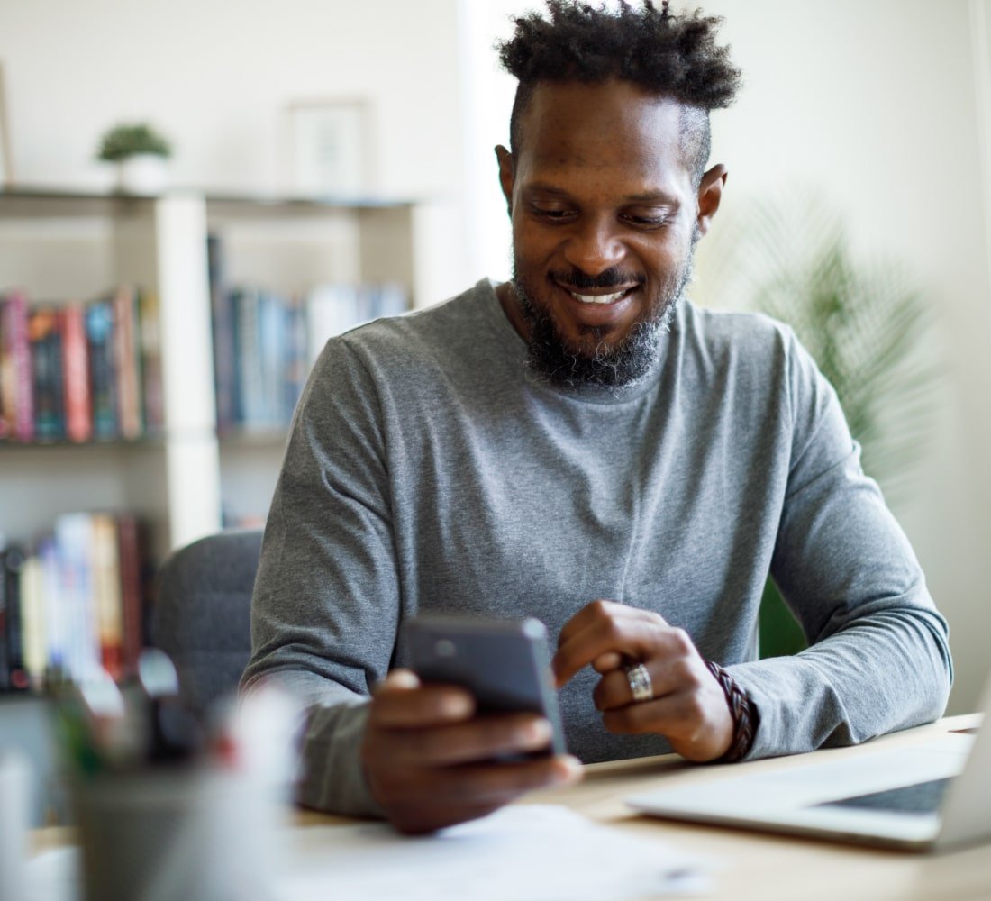 man looking at phone